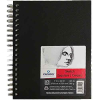 Black spiral-bound sketchbook with a Canson Sketch Croquis label on the cover.