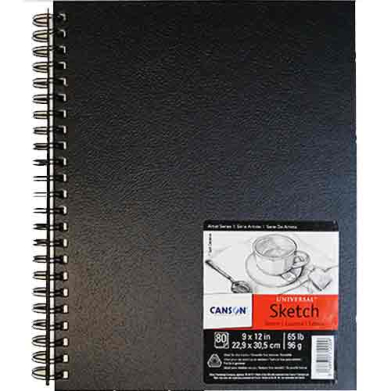 Black spiral-bound notebook with a textured black cover and a label in the bottom-right corner.