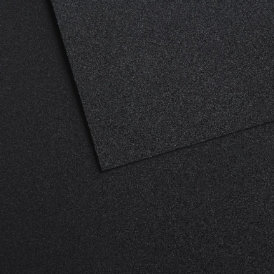 Close-up of a dark charcoal textured surface with overlapping panels creating diagonal edges.