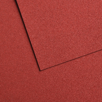 Close-up of red textured panels overlapping with a diagonal seam between them.