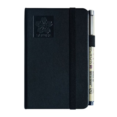 Black Sakura notebook with elastic band and a pen clipped to the side on a white background