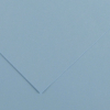 Close-up of light blue paper with two overlapping sheets forming a corner fold and soft shadows.