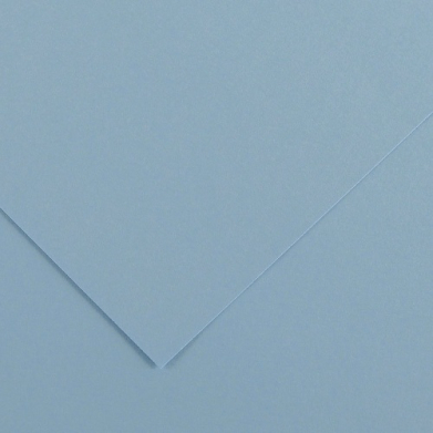 Close-up of light blue paper with two overlapping sheets forming a corner fold and soft shadows.