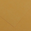 Close-up of overlapping tan kraft paper sheets with a folded corner.