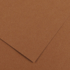 Overlapping sheets of brown cardboard viewed from above, showing textured surface and edges.