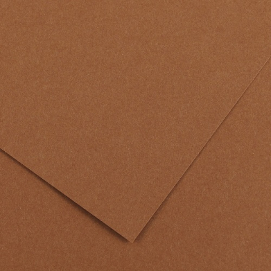 Overlapping sheets of brown cardboard viewed from above, showing textured surface and edges.