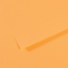 Close-up of orange textured paper with a folded edge and subtle shadows.