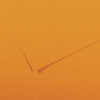 Close-up of textured orange paper with diagonal fold lines creating abstract shapes.