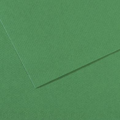 Two overlapping green textured sheets of paper or cardstock, shown at an angle.