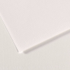 Close-up of two white textured paper sheets, one edge angled, with faint embossing along the surface.