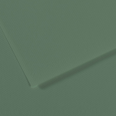 Close-up of green textured material with a diagonal seam and overlapping corner, like leather or heavy paper texture used as a background.