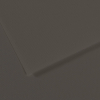 Close-up of dark gray textured paper with overlapping edges creating subtle shadows.