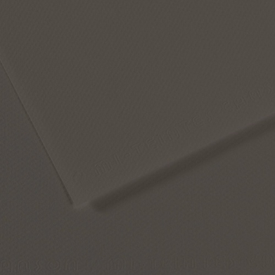 Close-up of dark gray textured paper with overlapping edges creating subtle shadows.