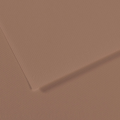 Close-up of brown cardboard sheets with a textured surface and a folded edge.