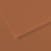 Close-up of orange textured paper with a diagonal fold and subtle grainy surface.