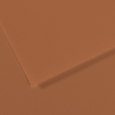 Close-up of orange textured paper with a diagonal fold and subtle grainy surface.