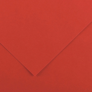 Close-up of red-orange paper with folded edges forming a diagonal V-shaped overlap.