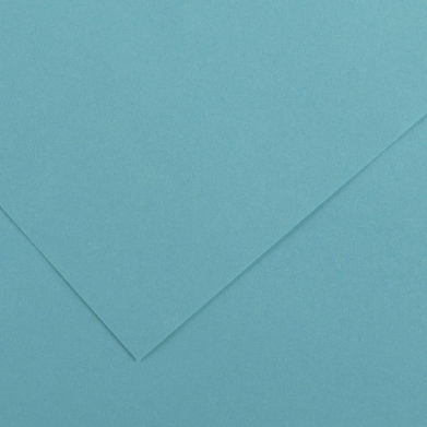 Close-up of teal blue textured paper with a diagonal fold creating a corner.
