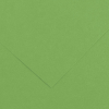Close-up of green textured paper with folded corners forming a chevron shape in the center-right area.