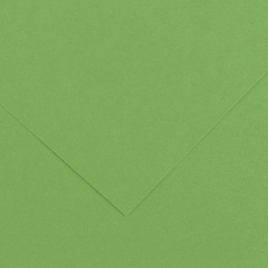 Close-up of green textured paper with folded corners forming a chevron shape in the center-right area.
