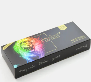 Black rectangular paint box with a colorful rainbow lion graphic on the lid, used for a watercolors set. The top features gold text and the side shows cursive branding.