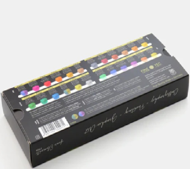 Box of assorted colorful markers arranged on top of a black packaging box, viewed at an angle.
