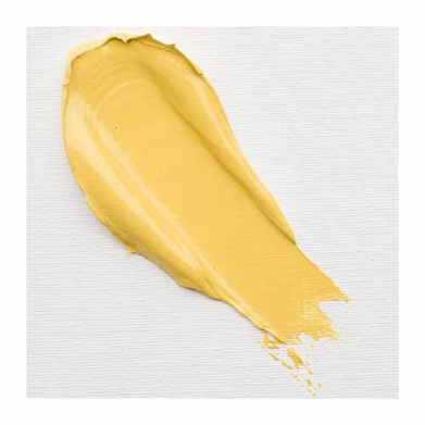 Yellow cream foundation swatch spread across a white textured surface.